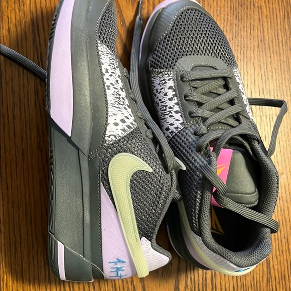 grey nike shoes with black swoosh